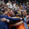 A picture of ESN volunteers hugging during the General Assembly